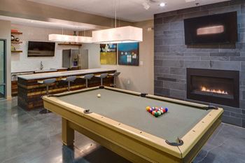 Clubroom with billiards and shuffleboard